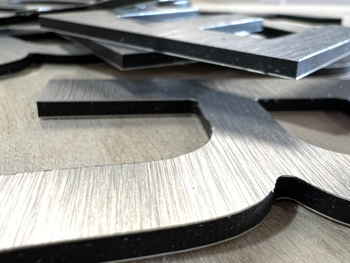 An array of 1/2 inch black acrylic showing detail of very small details