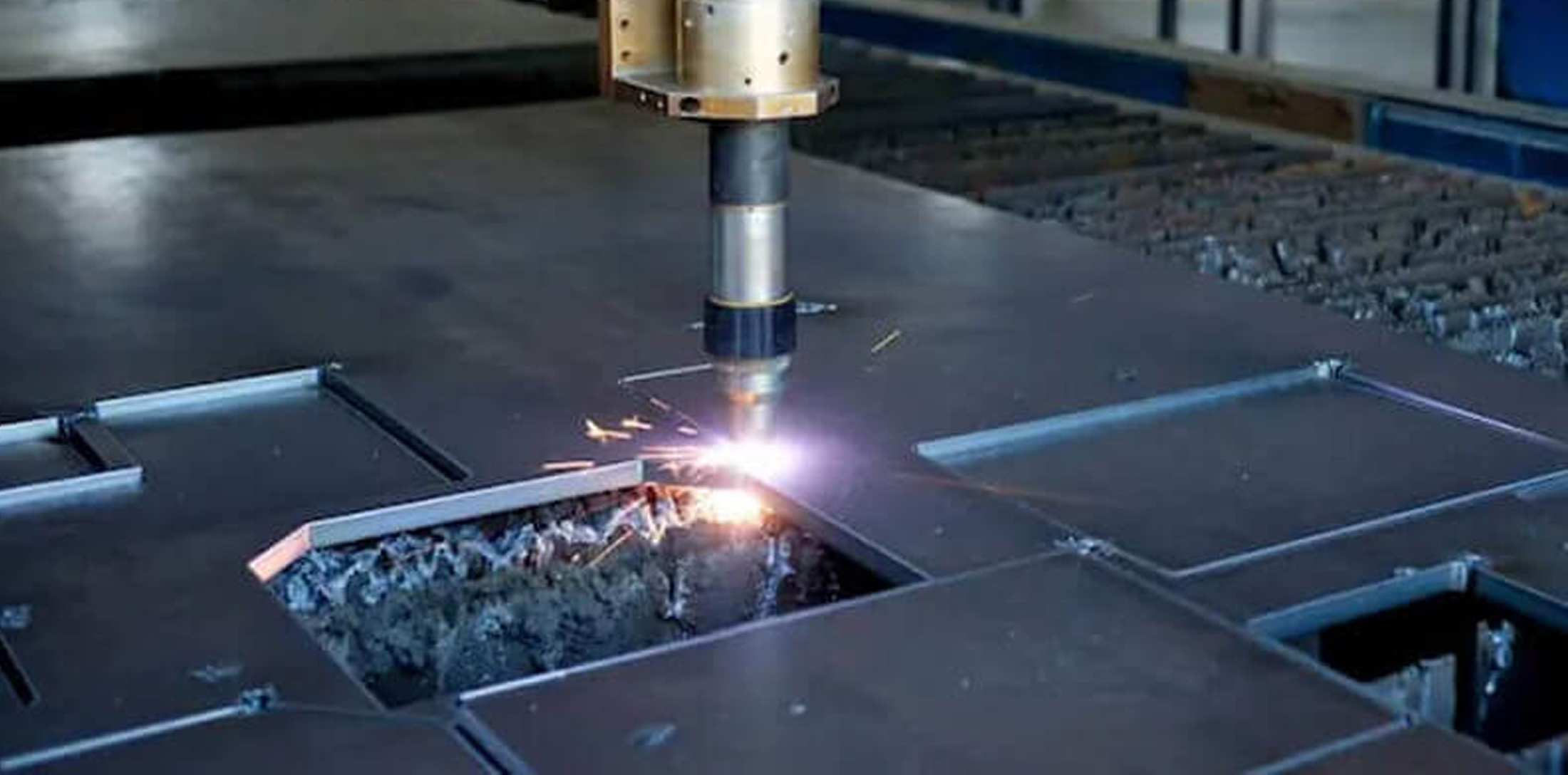 A plasma cutter blasting through heavu gauge steel