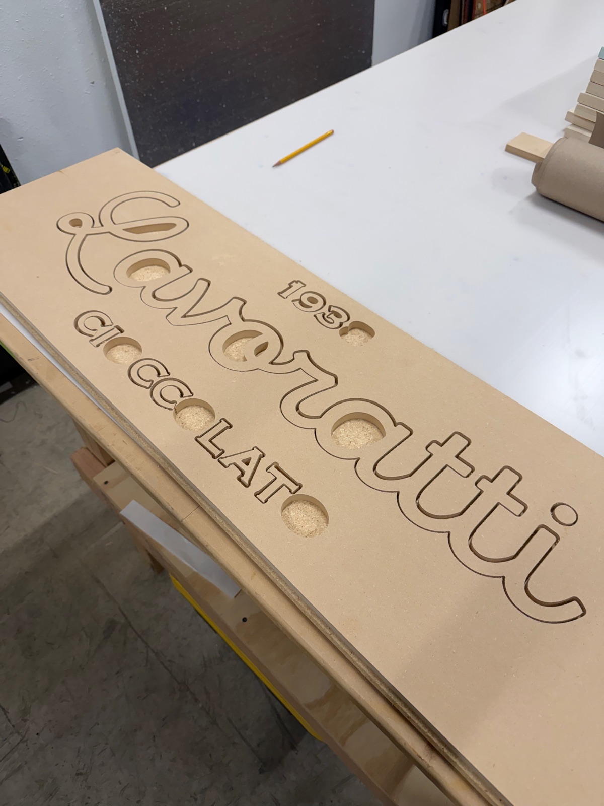 Lavoratti Cioccolato script lettering and 1938 date routed from MDF as individual dimensional letters