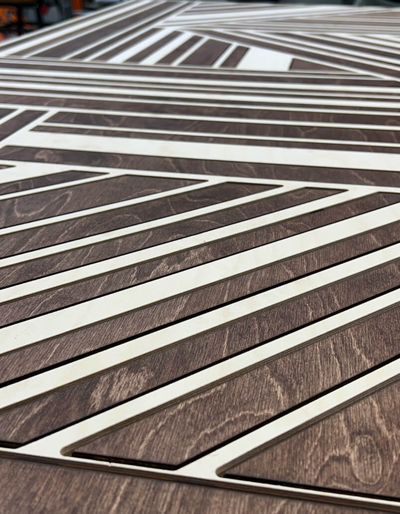 Close-up assembly detail showing the geometry and grain of the top-layer pieces