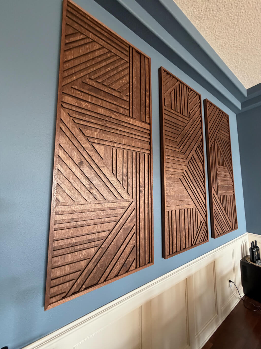 Detail shot of the installed monogrammed wall art panels